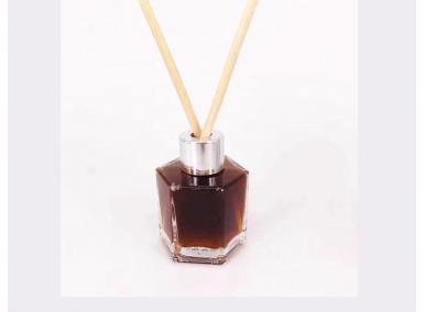 frasco de perfume marrón