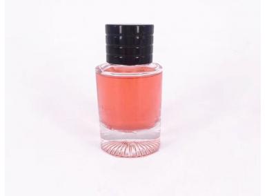 frasco de perfume redondo rosa