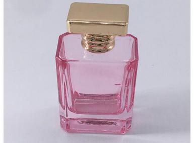 botella de perfume rosa vacía